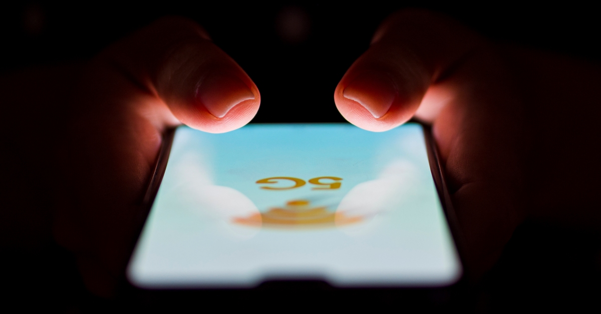 Smart phone close-up person holding phone 1200x628 1